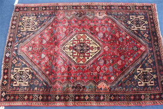 An Iranian red ground rug, 165 x 113cm